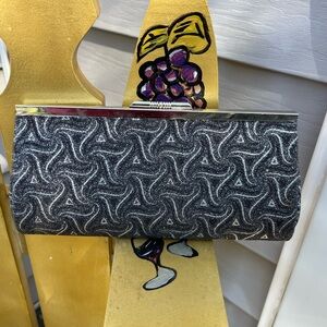 Sparkly Metallic Black and Silver Ladies Clutch adds elegance to any occasion.